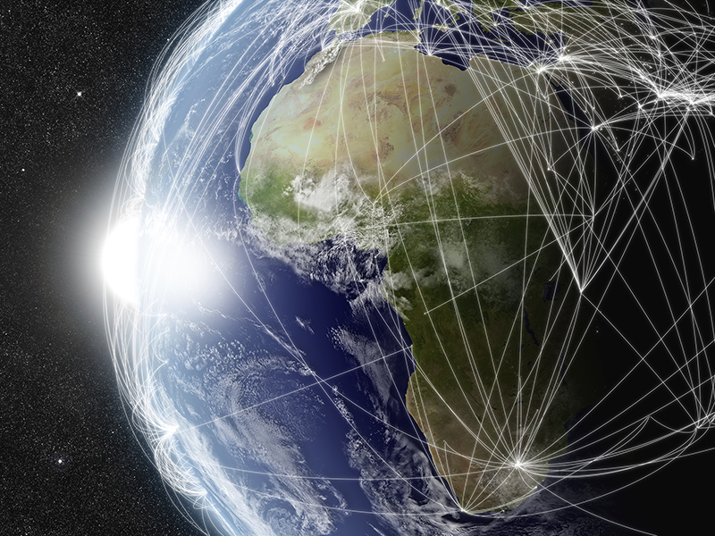 A globe with flight plan lines