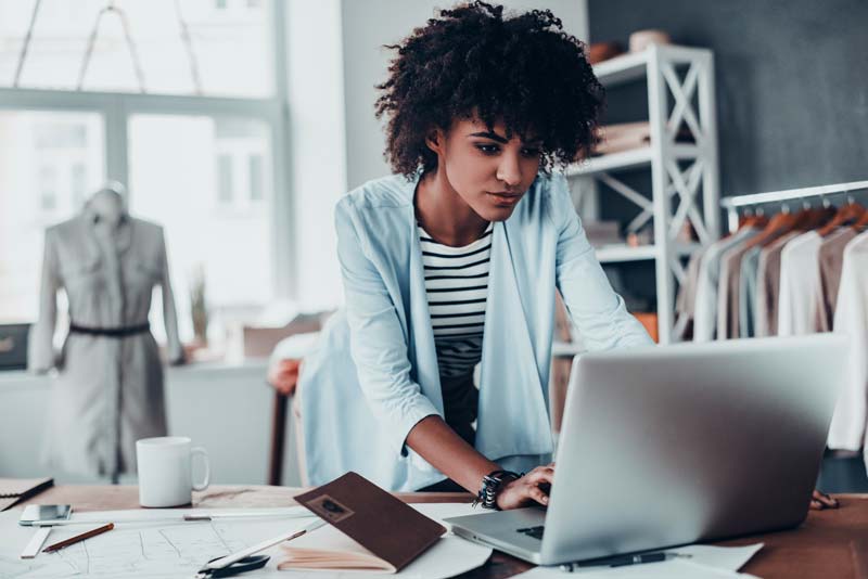 Female business owner looking at her computer